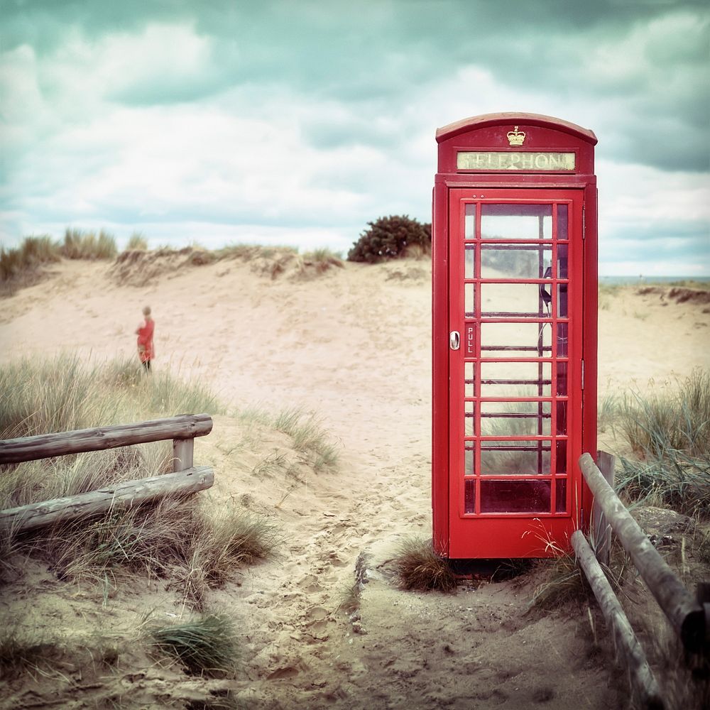 Res phone booth at beach. Free public domain CC0 photo.