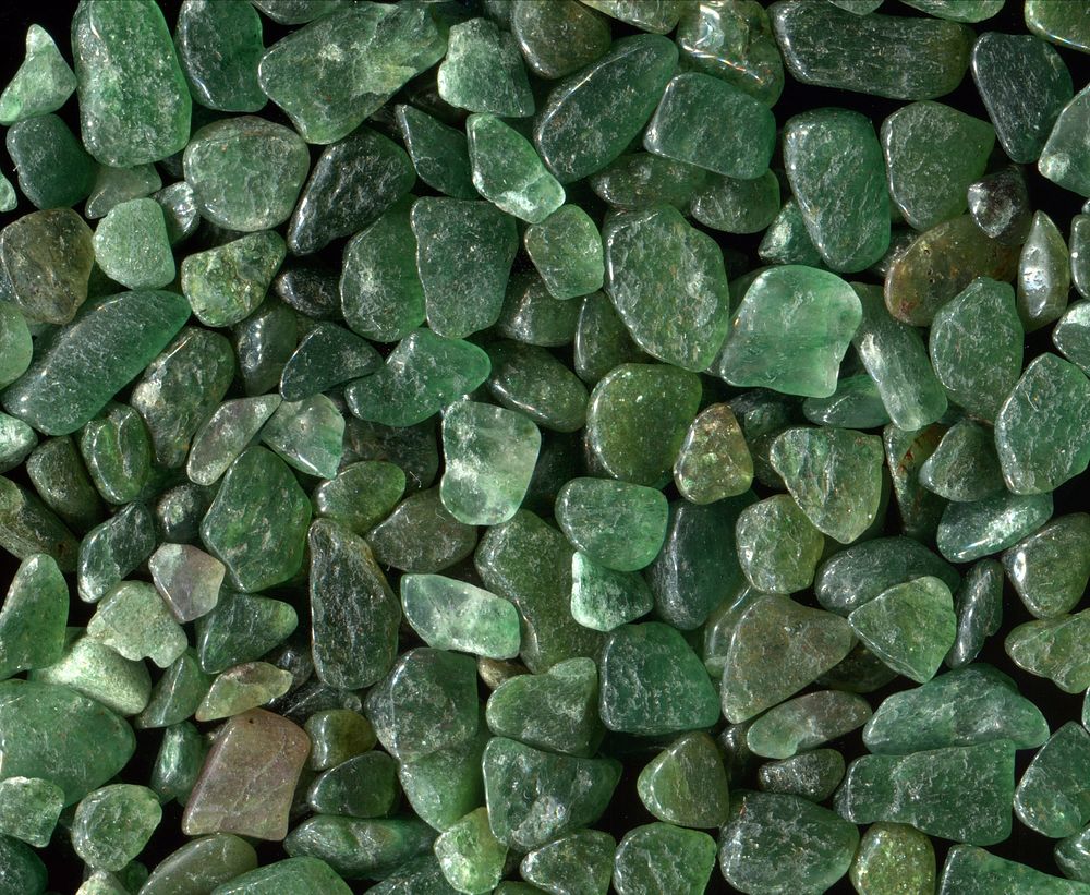 Scattered display of green stones. Free public domain CC0 photo.