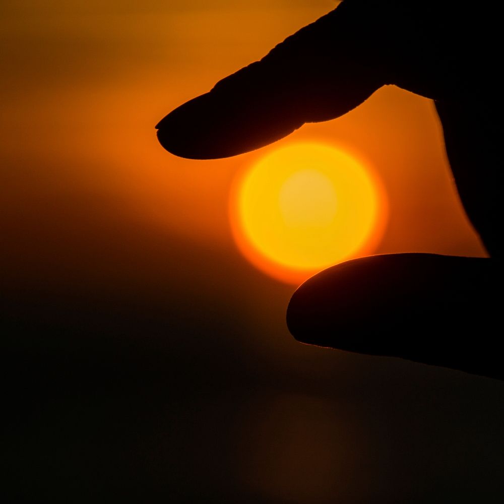 Small sun in fingers. Free public domain CC0 photo