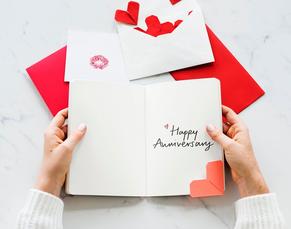 Woman holding a Happy Anniversary card