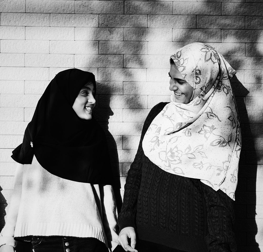 Muslim friends talking and smiling