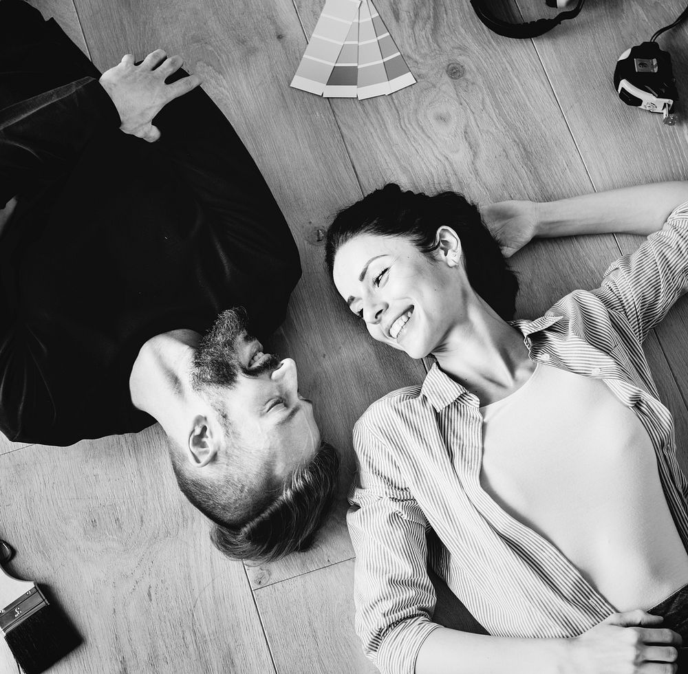 Family laying on the wooden floor