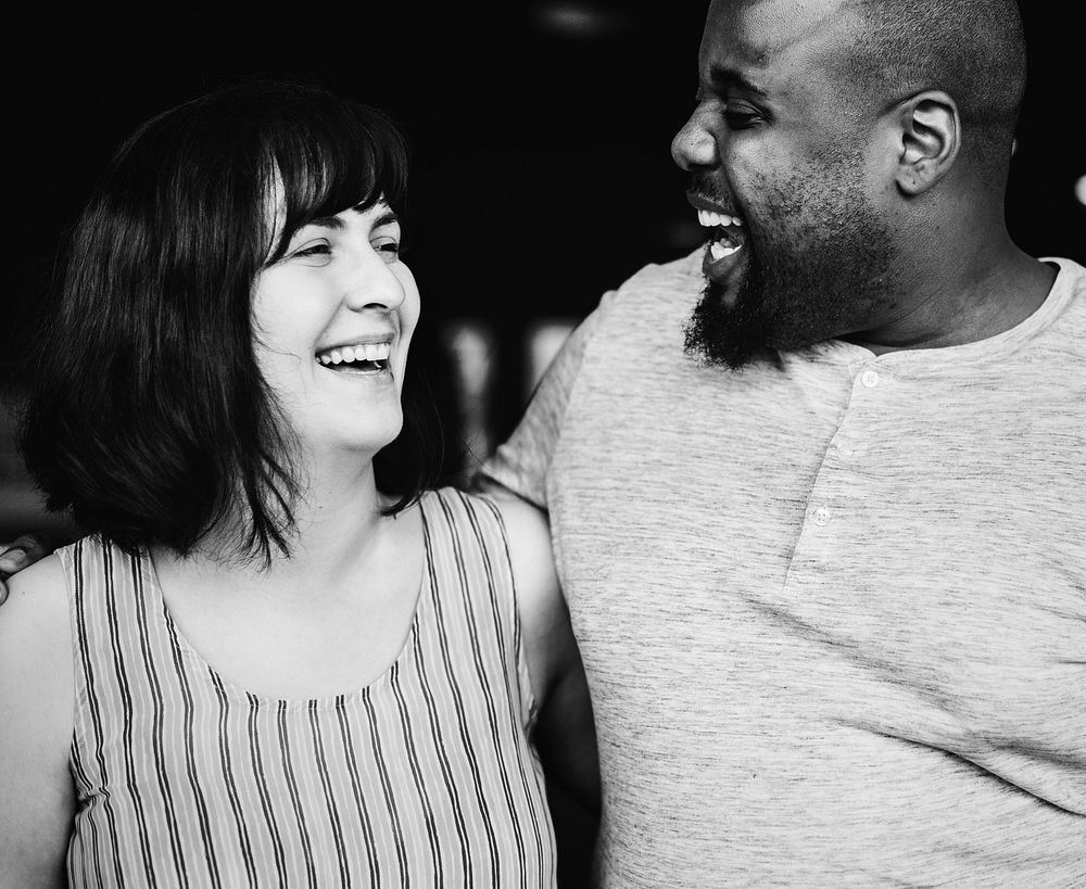 Happy  diverse couple laughing together