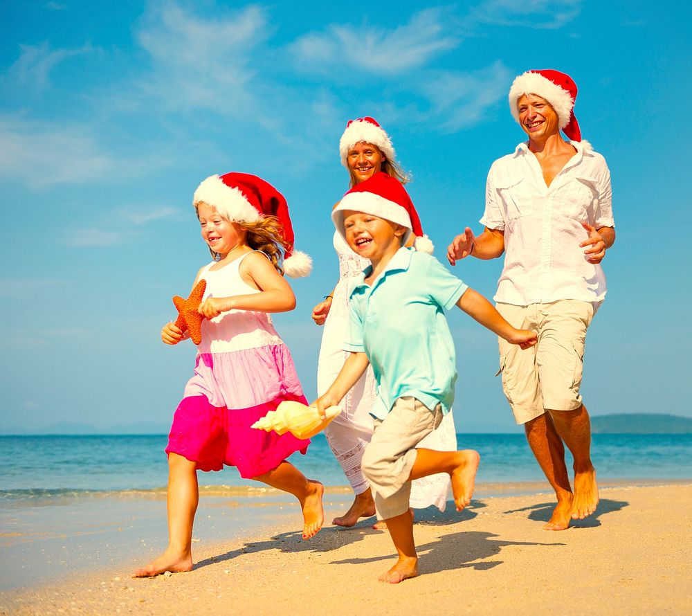 Family enjoying a Christmas holiday at the beach