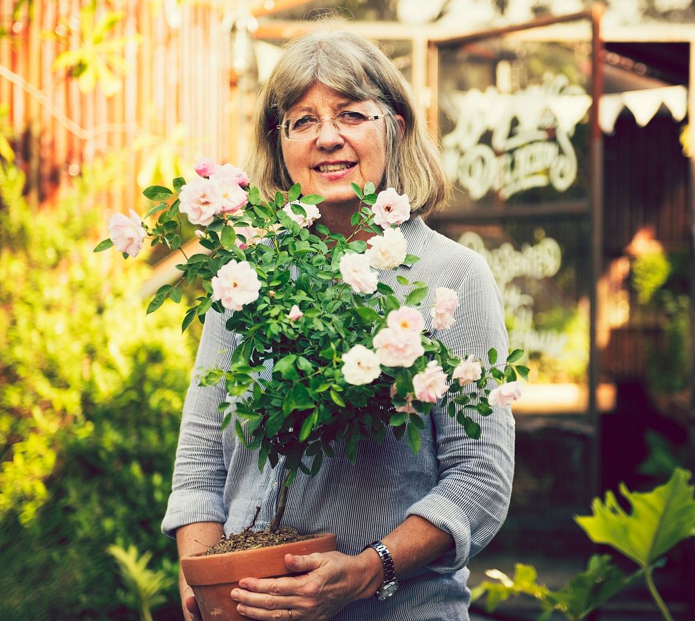 Mature woman tending to her plants