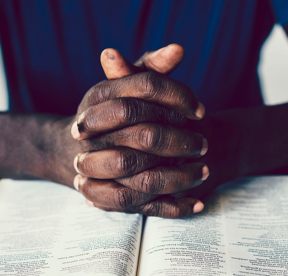 African American man praying to God