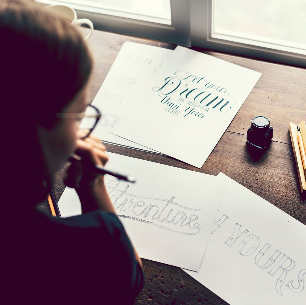 Girl creating a typography illustration