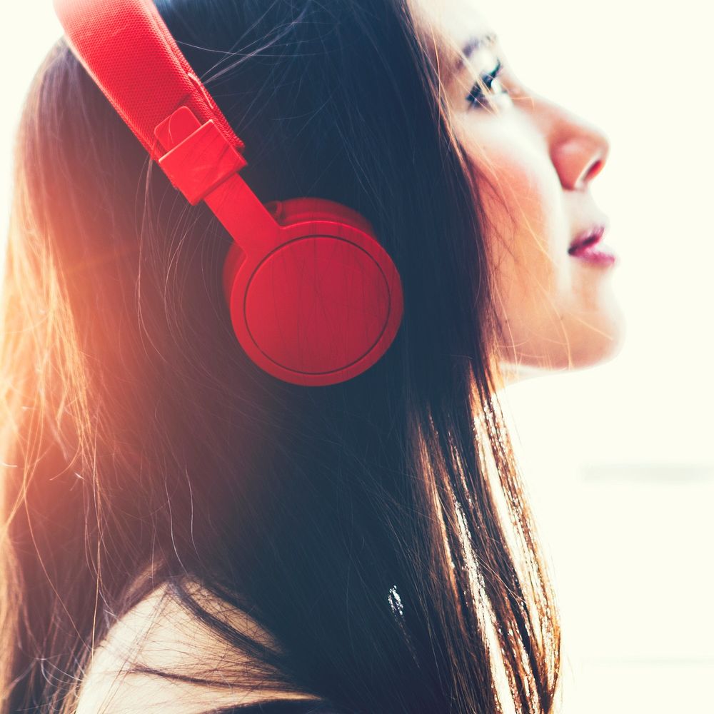 Girl wearing headphones and listening to music
