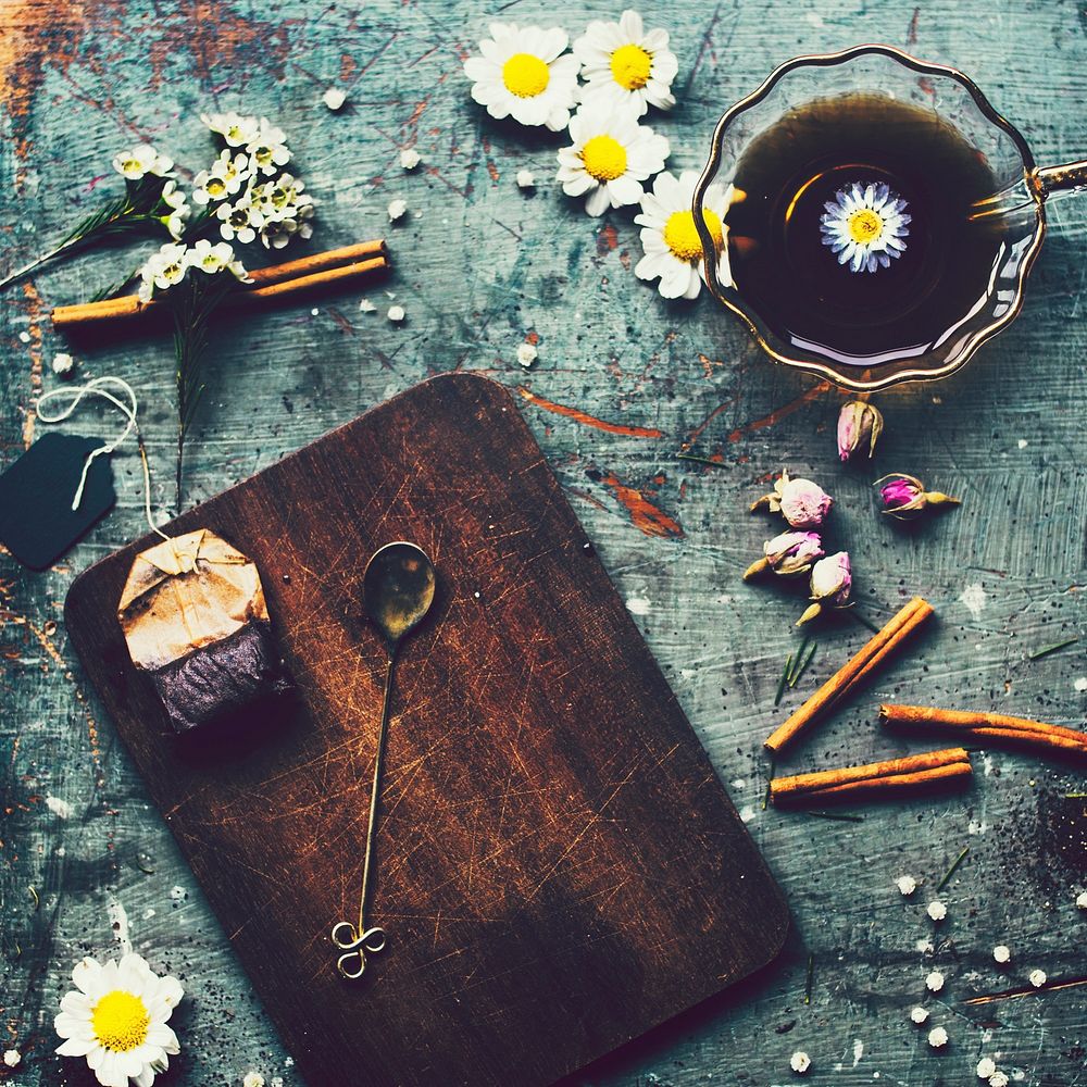 Aerial view of tea cup with flowers decoration