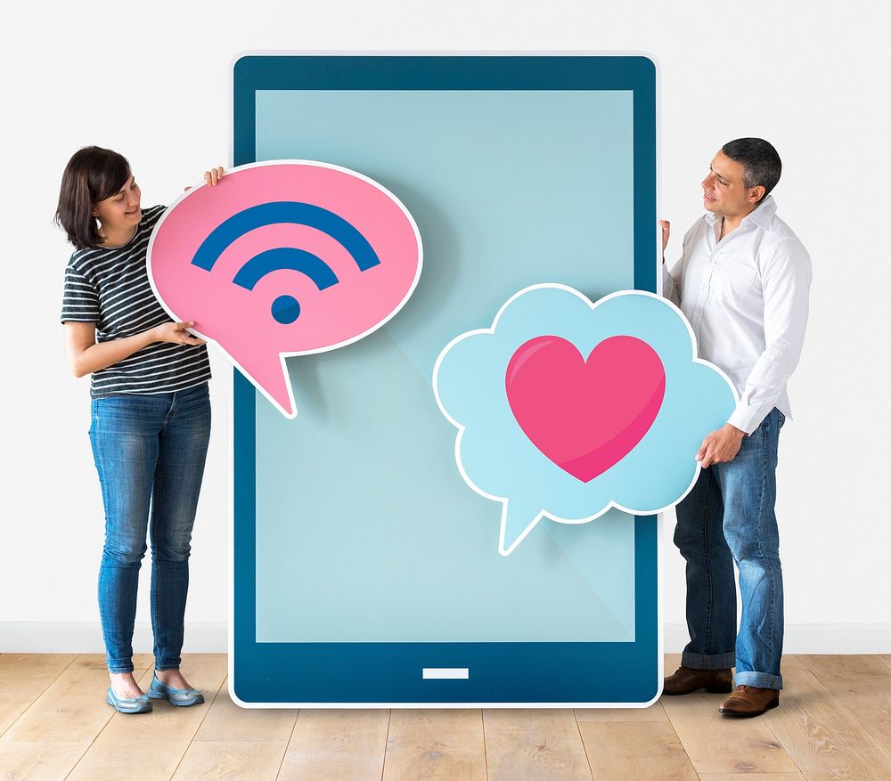 Couple holding a big digital tablet