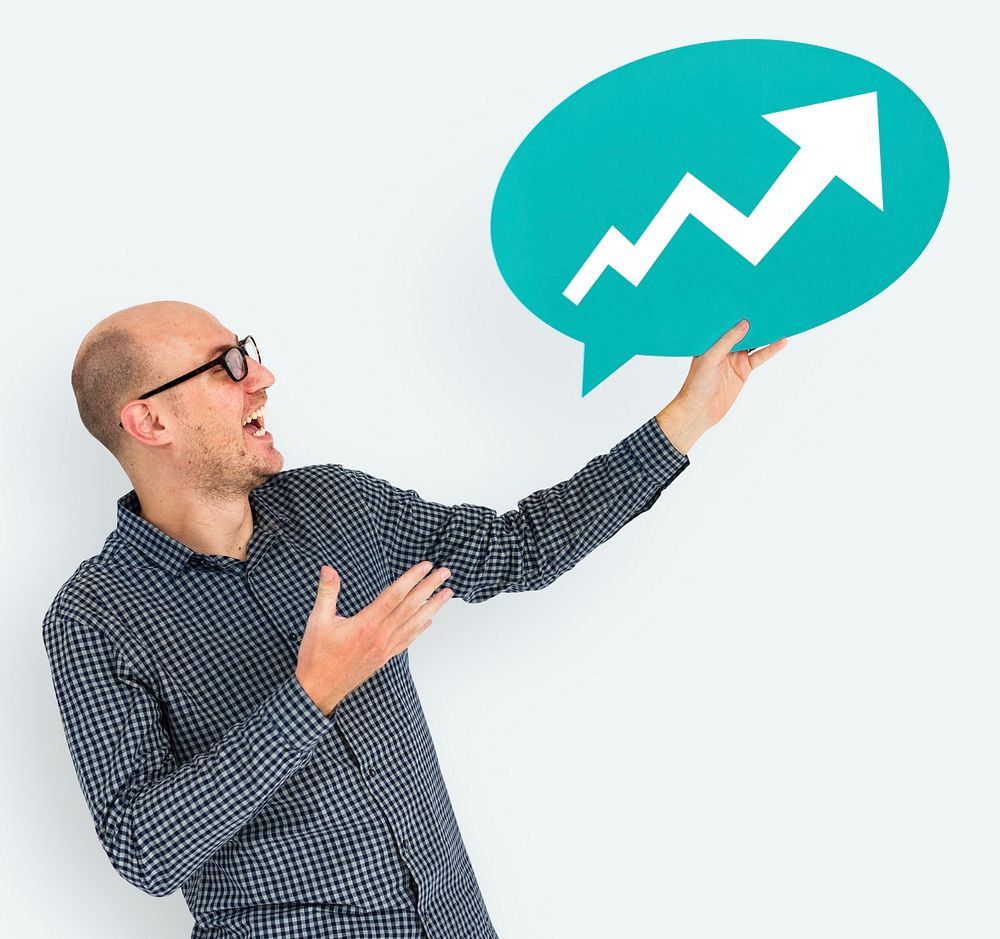 Businessman holding speech bubble with growth icon