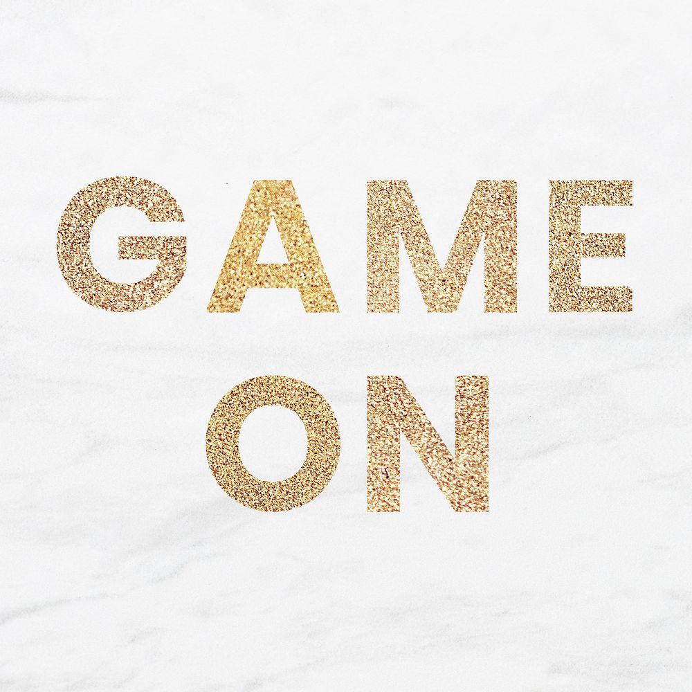 Glittery game on typography on a white marble background