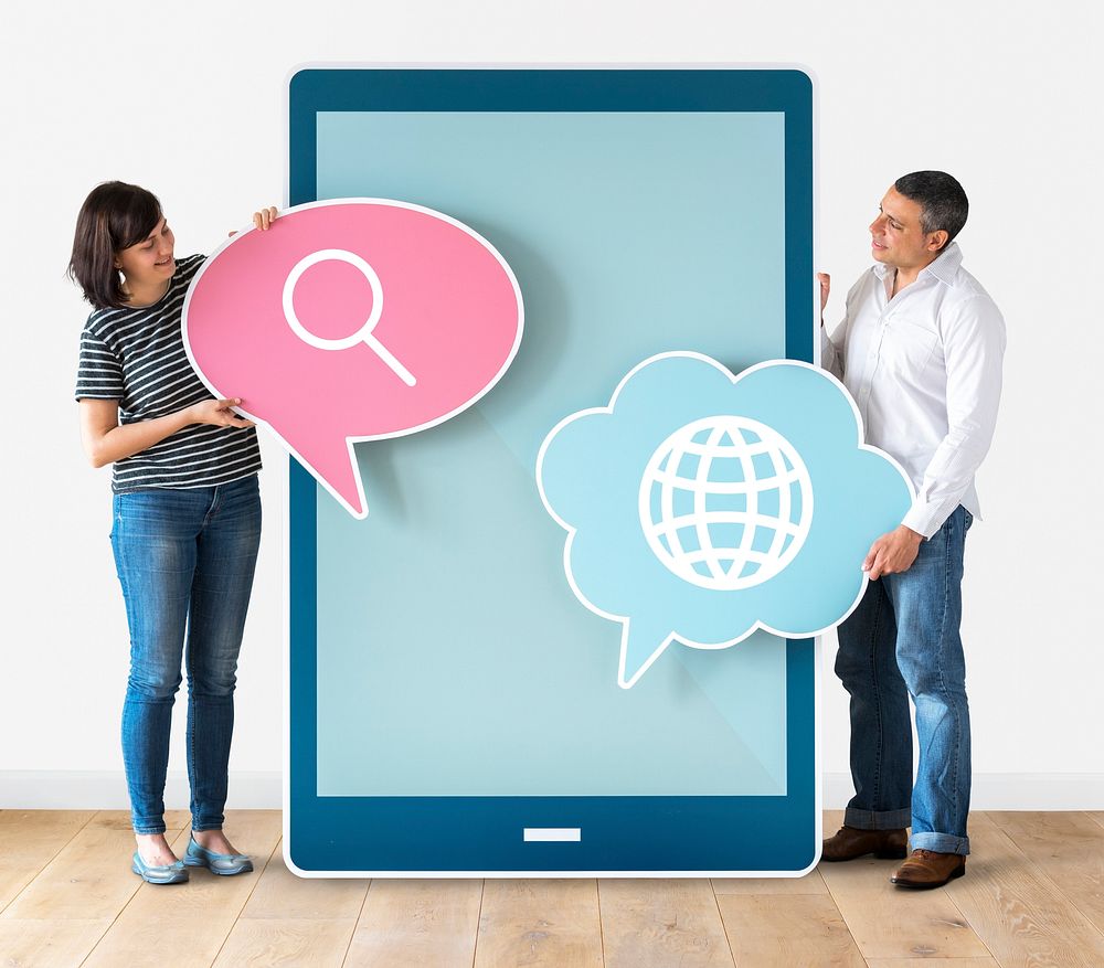 Couple holding speech bubbles and tablet