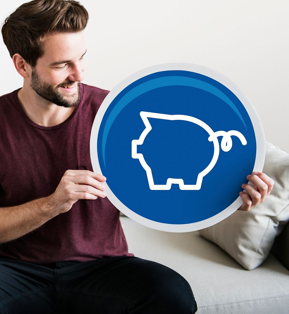 Young man holding a piggy bank icon