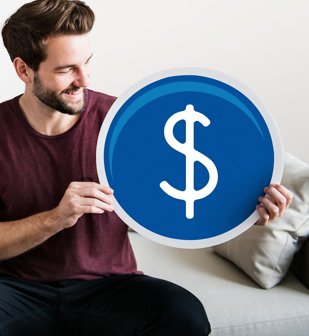 Young man holding a dollar icon