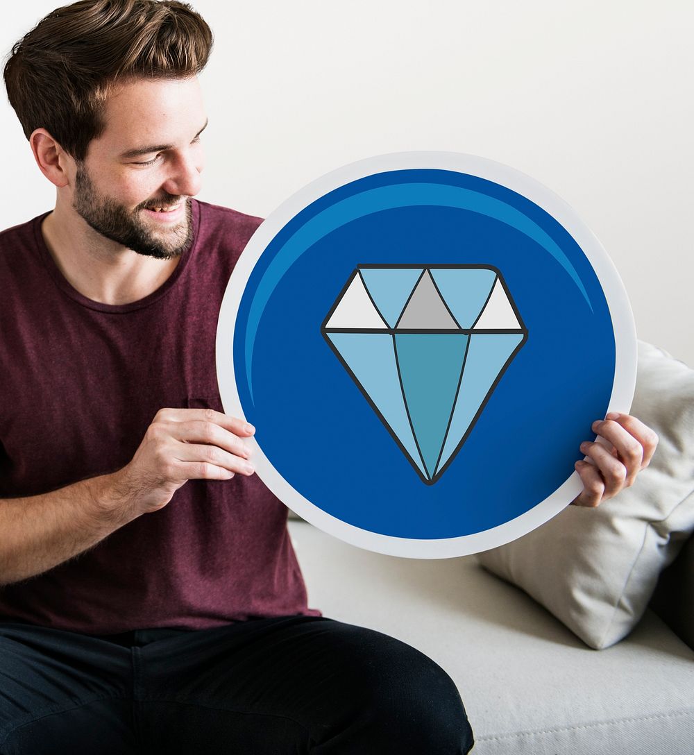 Young man holding a diamond icon