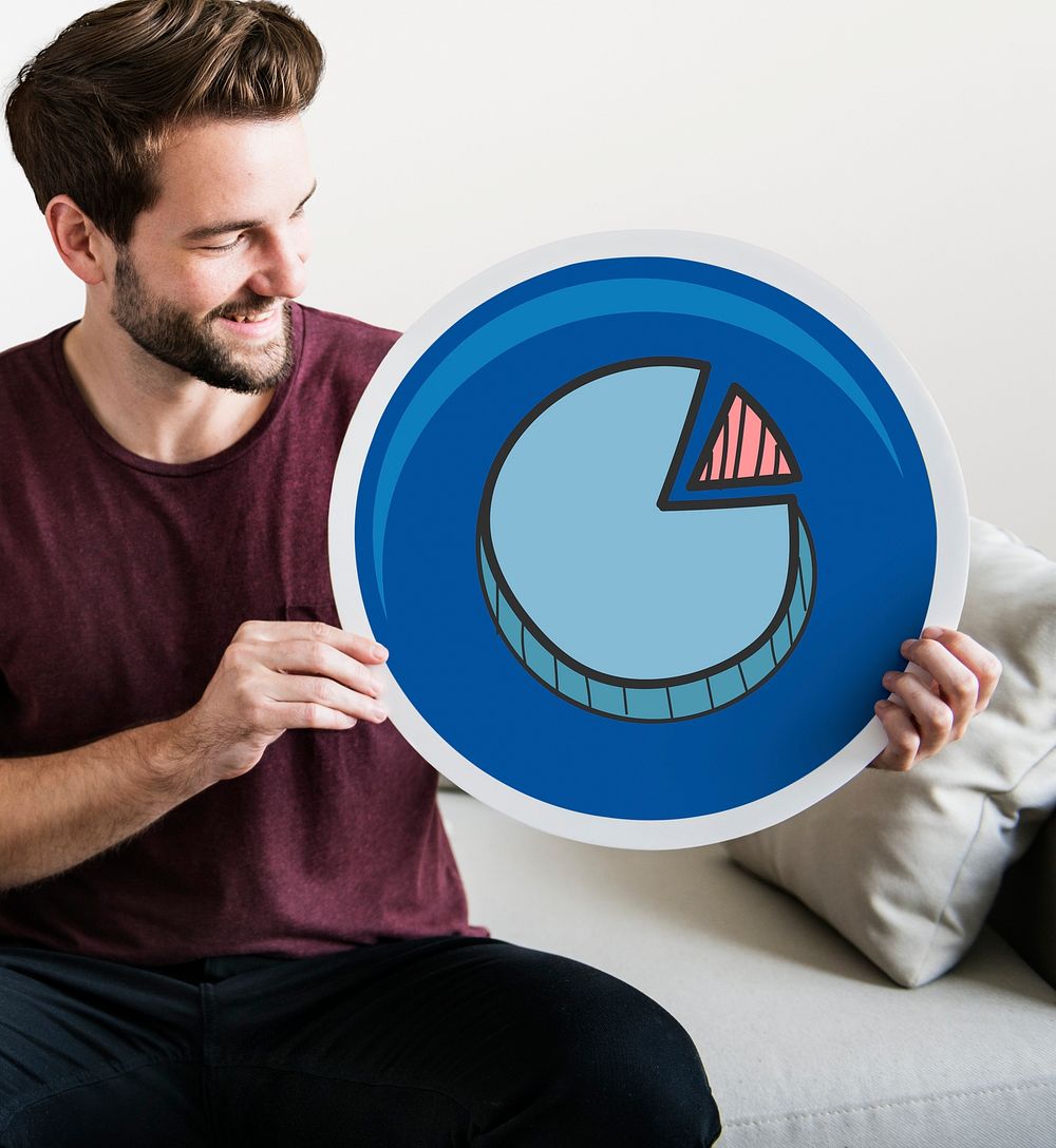 Young man holding a pie chart icon