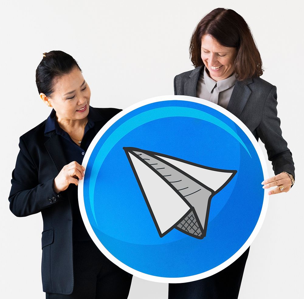 Businesswomen holding a paper plane icon