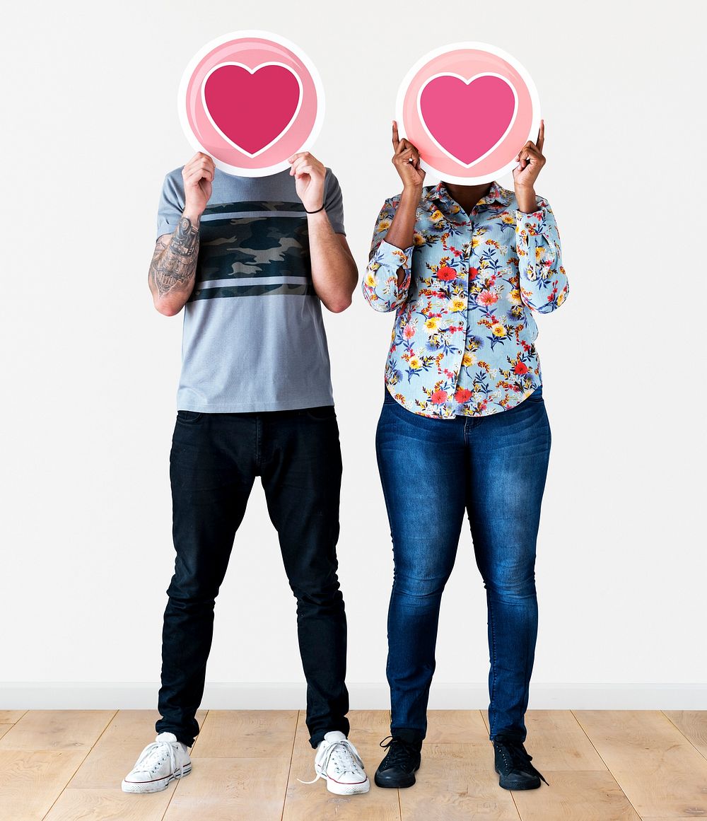 Couple holding valentine icons