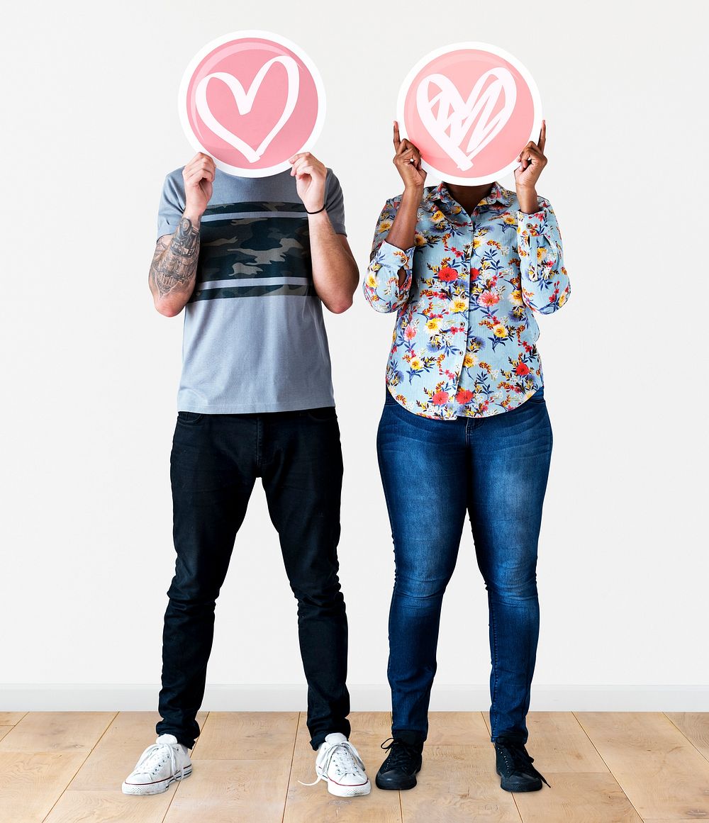 Couple holding valentine icons
