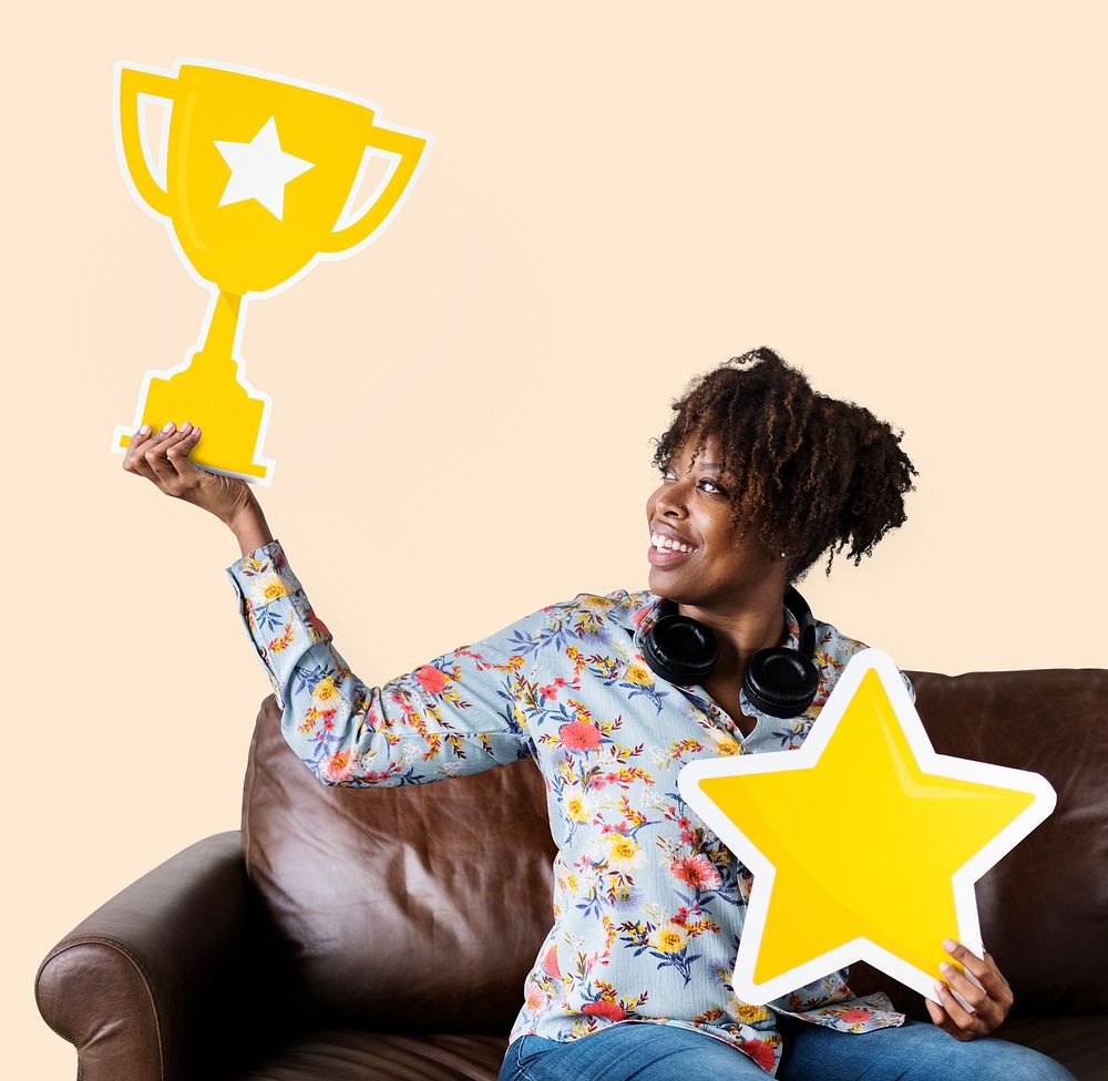Woman holding a trophy and star icon