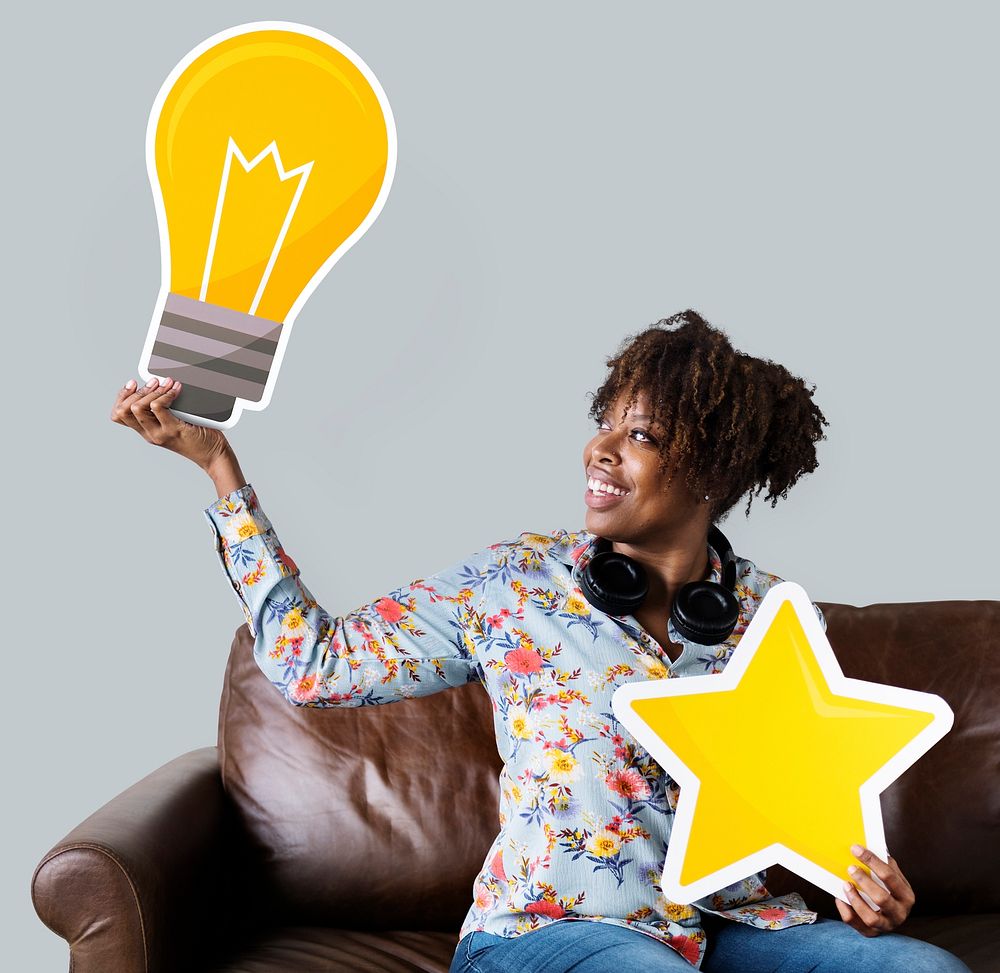 Woman showing light bulb icon on couch