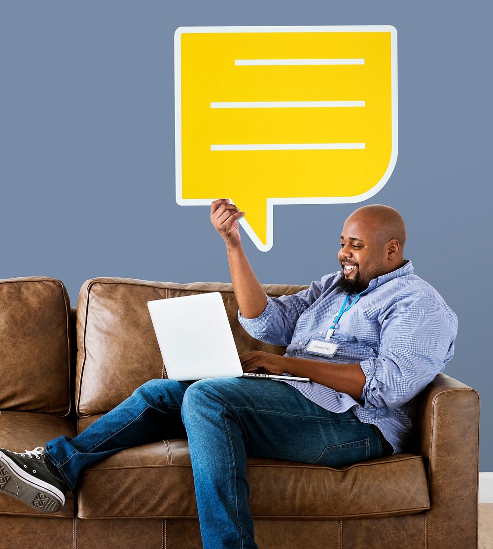Man showing yellow speech bubble icon