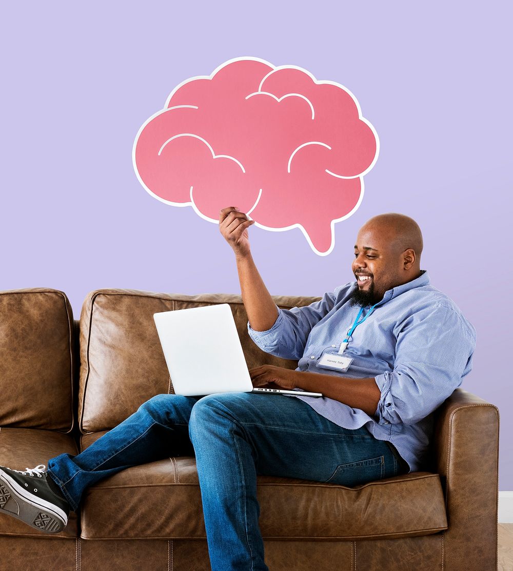 Man showing pink brain icon on couch