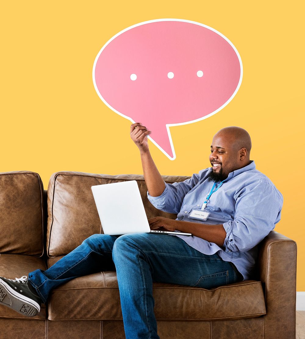 Man showing pink speech bubble icon