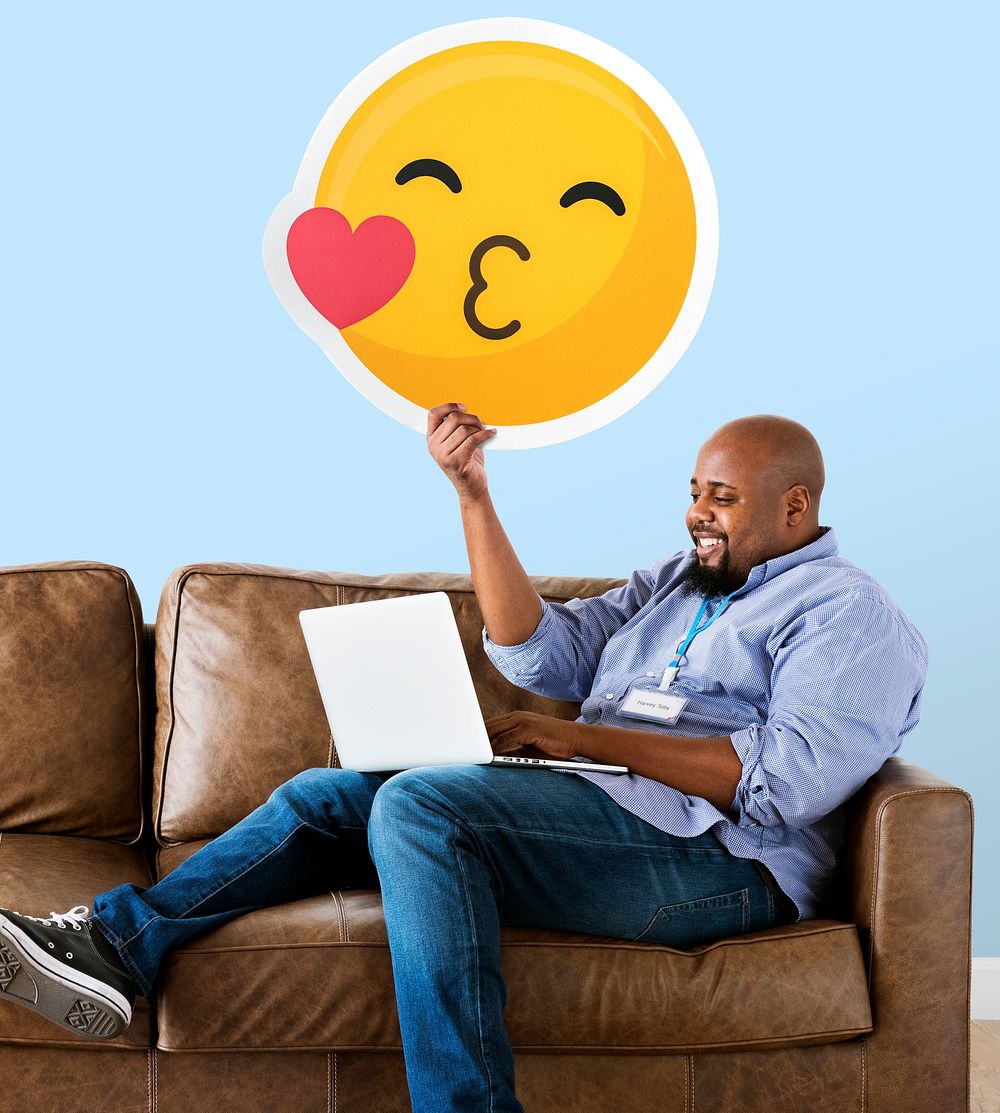 Man showing a kissing emoticon