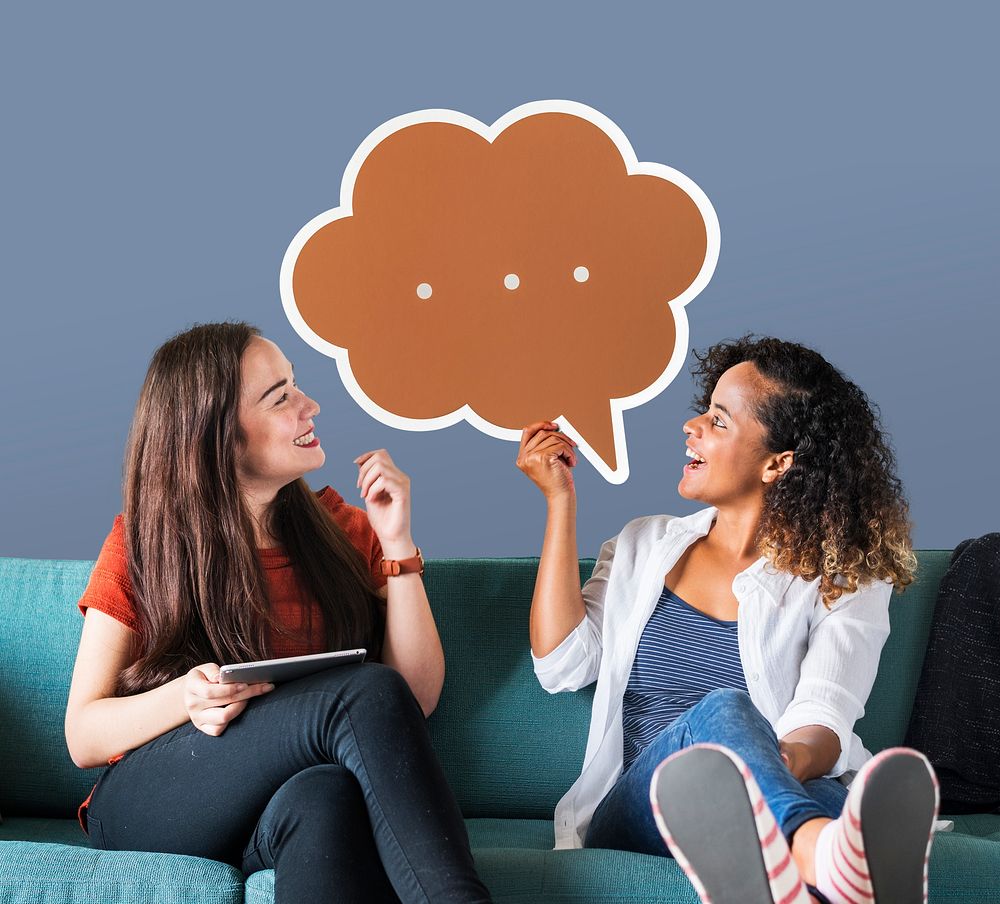 Cheerful women holding brown speech bubble icon