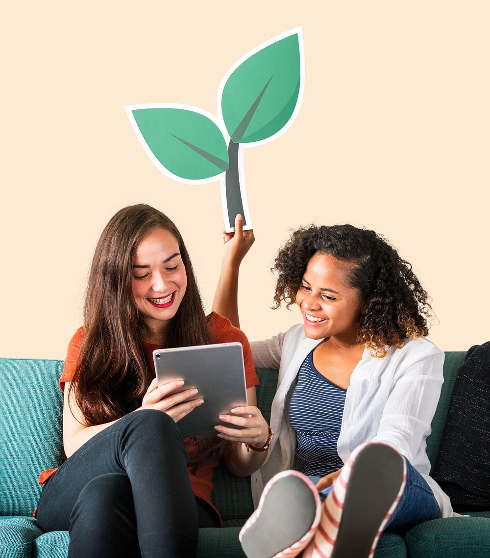 Women showing leaf icon and using tablet