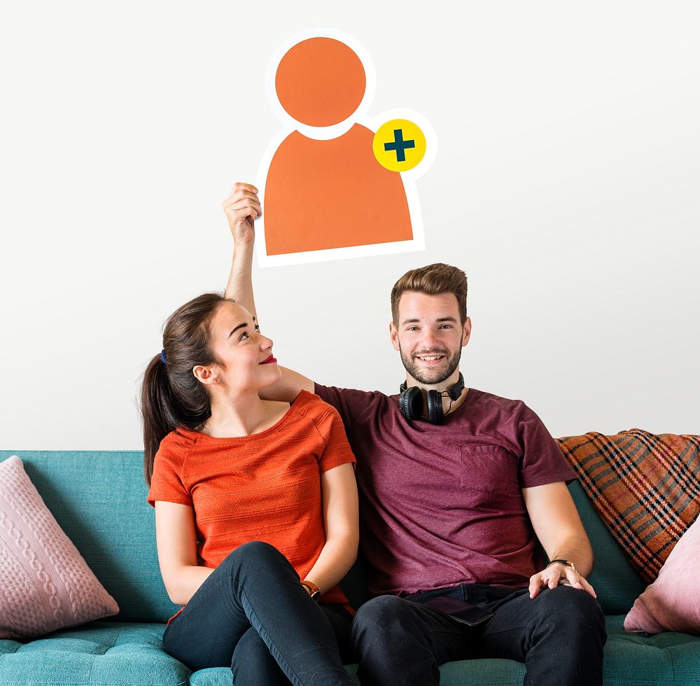 Cheerful couple holding a friend request icon