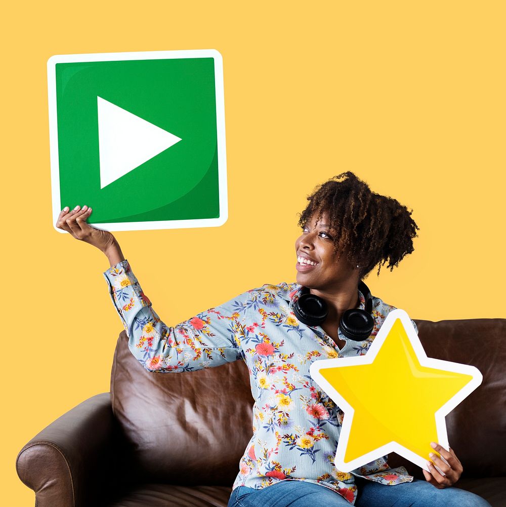 African American woman holding a play button icon