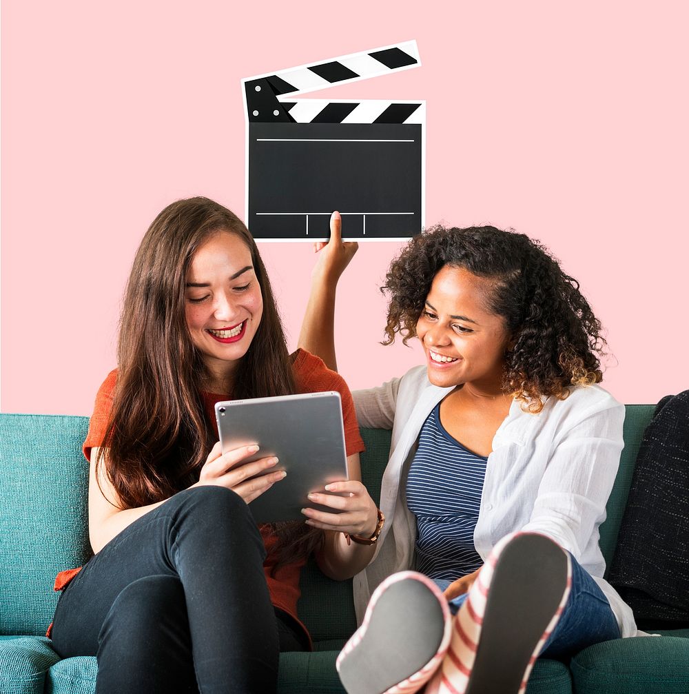 Young female friends holding a clapper icon