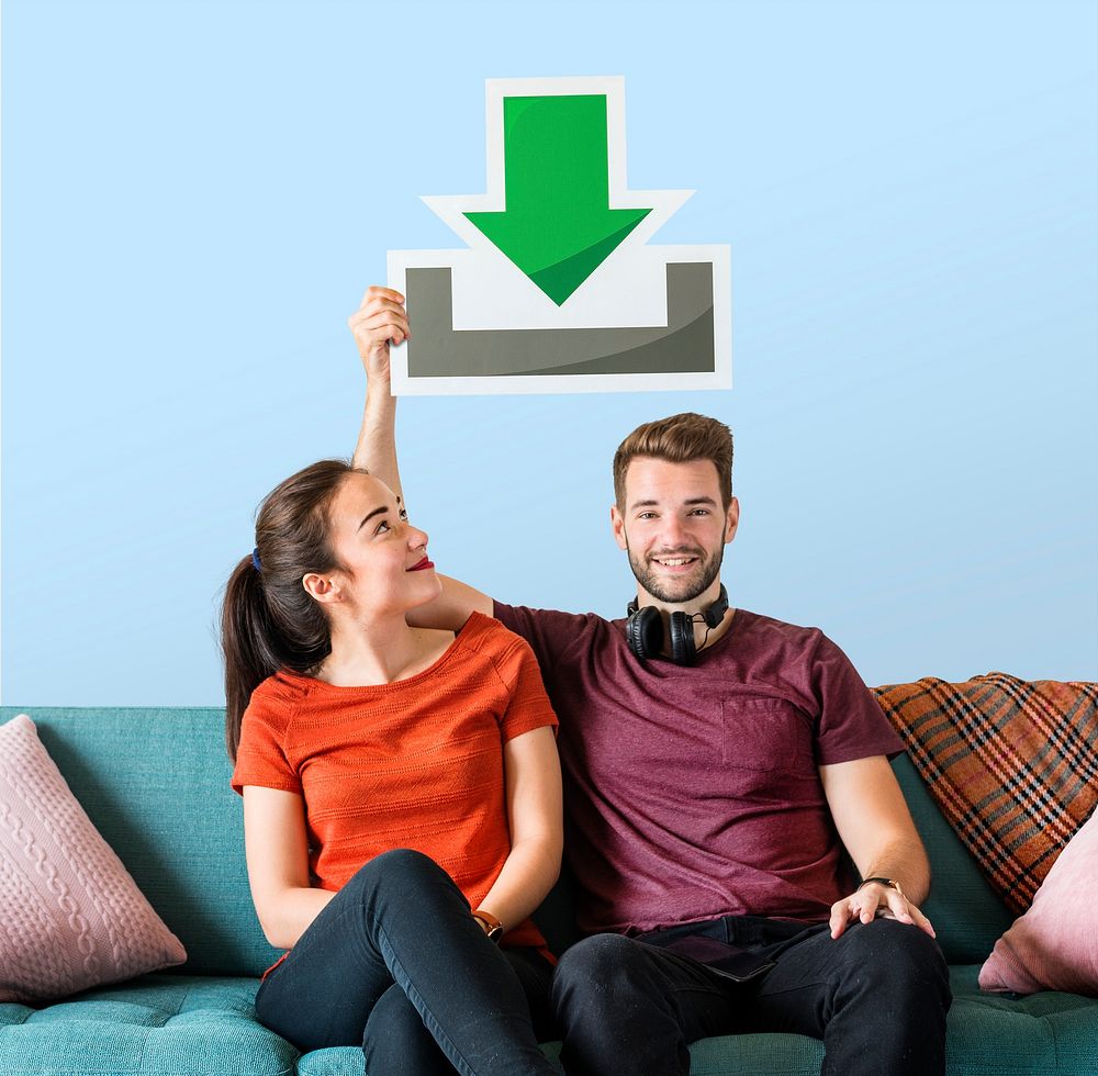 Young couple holding a download icon