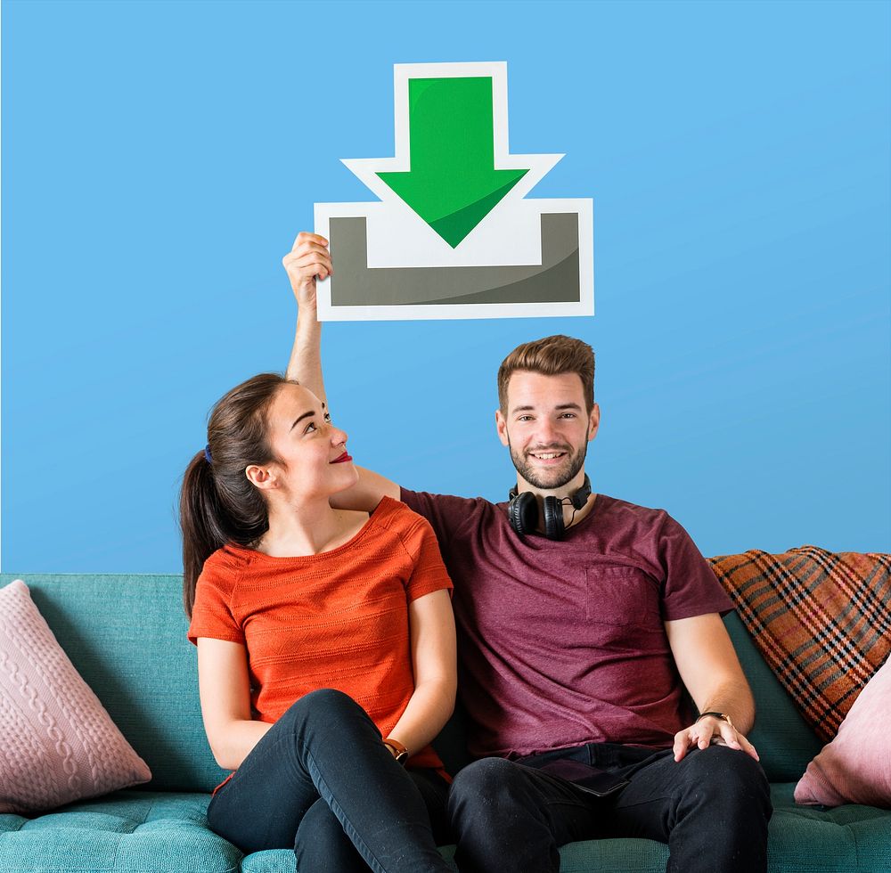 Young couple holding a download icon