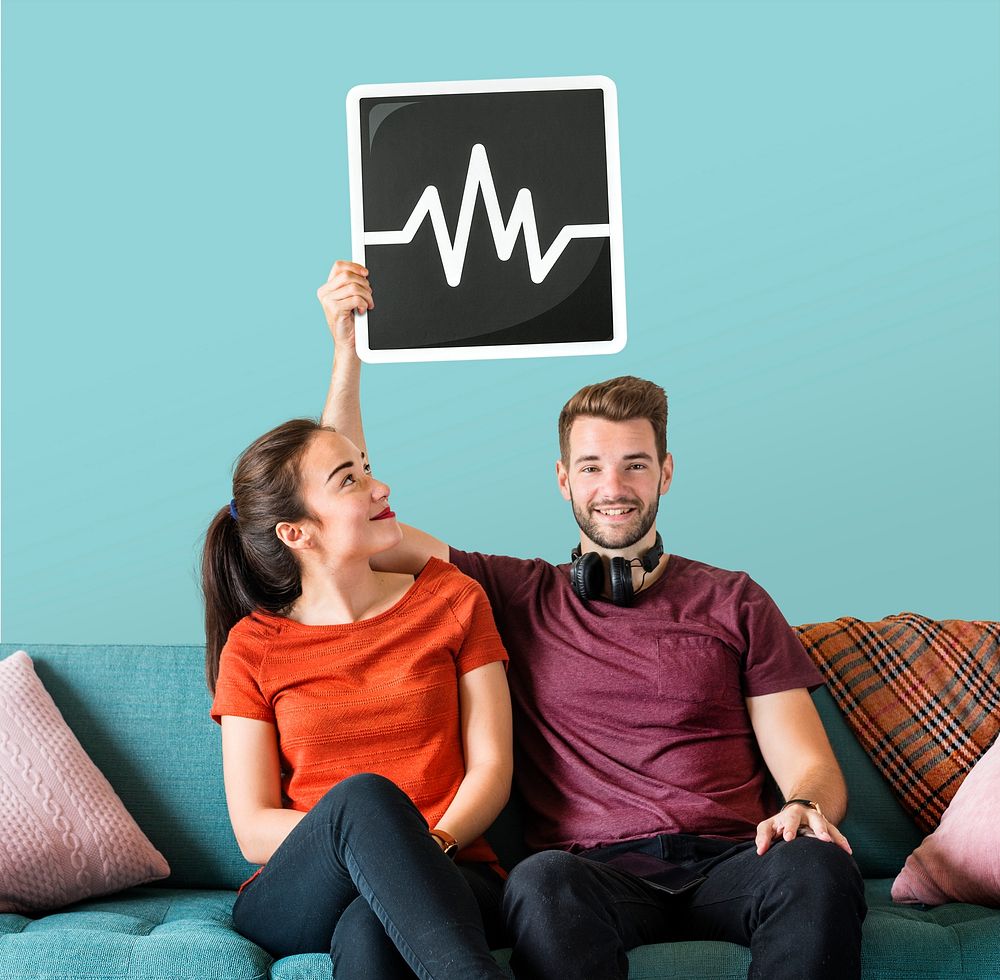 Young couple holding a frequency icon