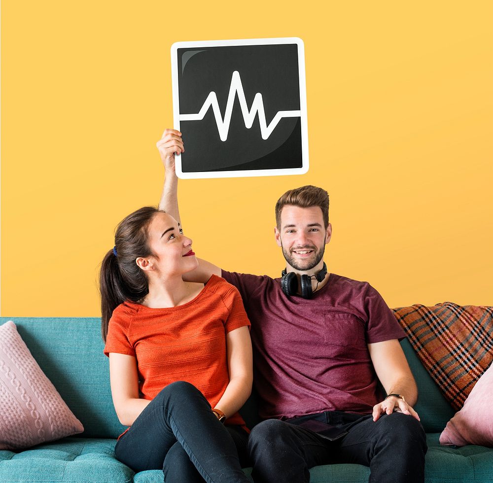 Young couple holding a frequency icon