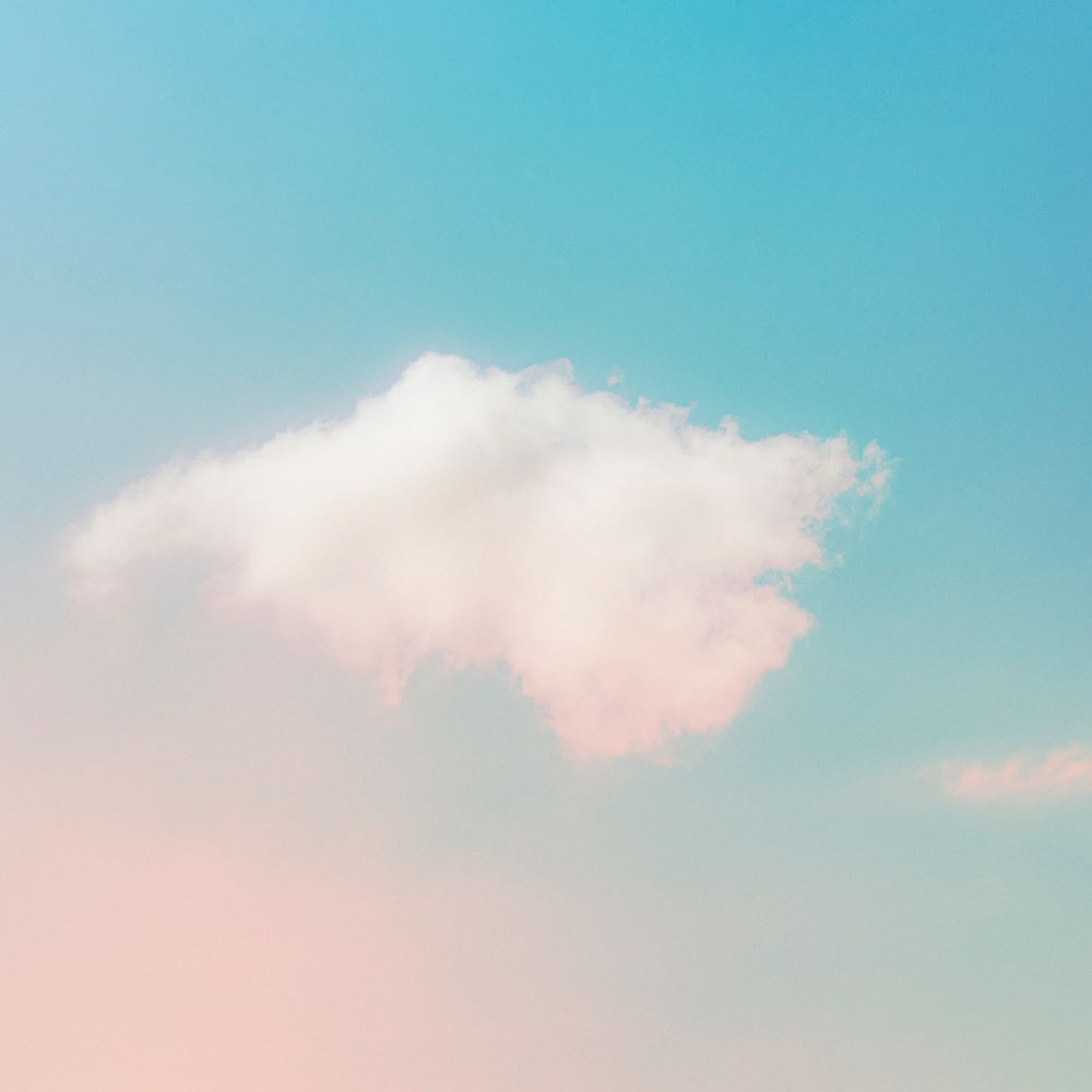 Pastel pink blue gradient sky with clouds background
