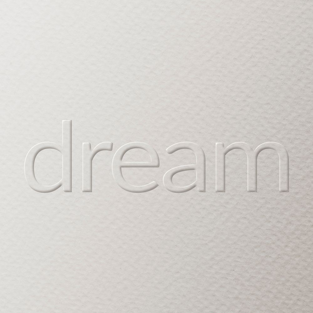 Dream embossed text white paper background