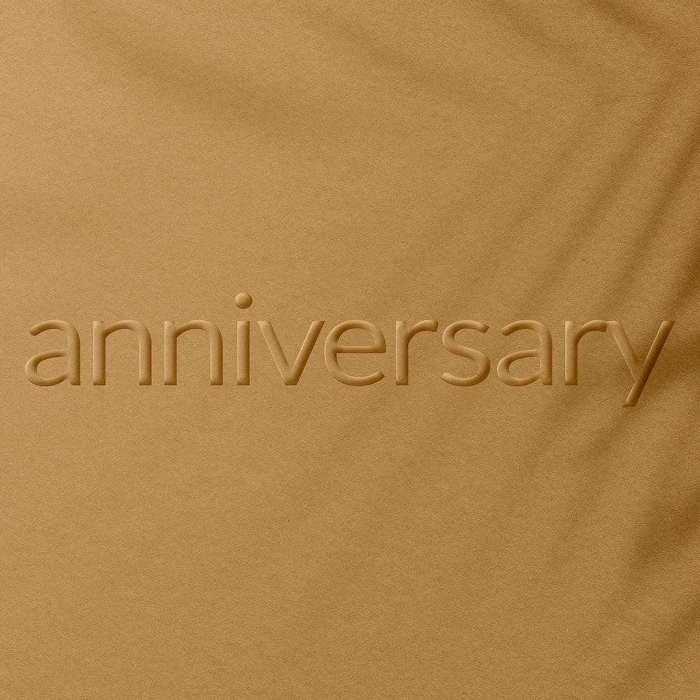 Anniversary word embossed concrete texture shadow plant