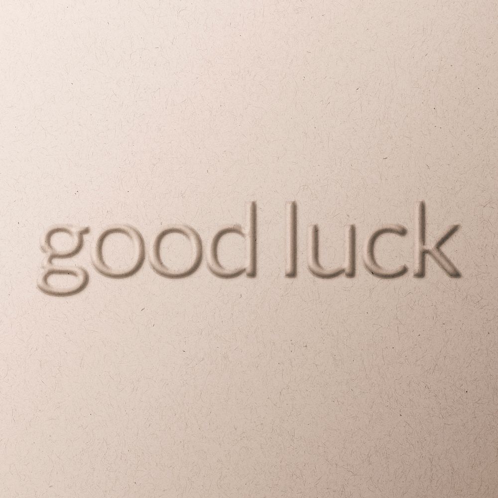 Good luck wish word emboss typography on paper texture