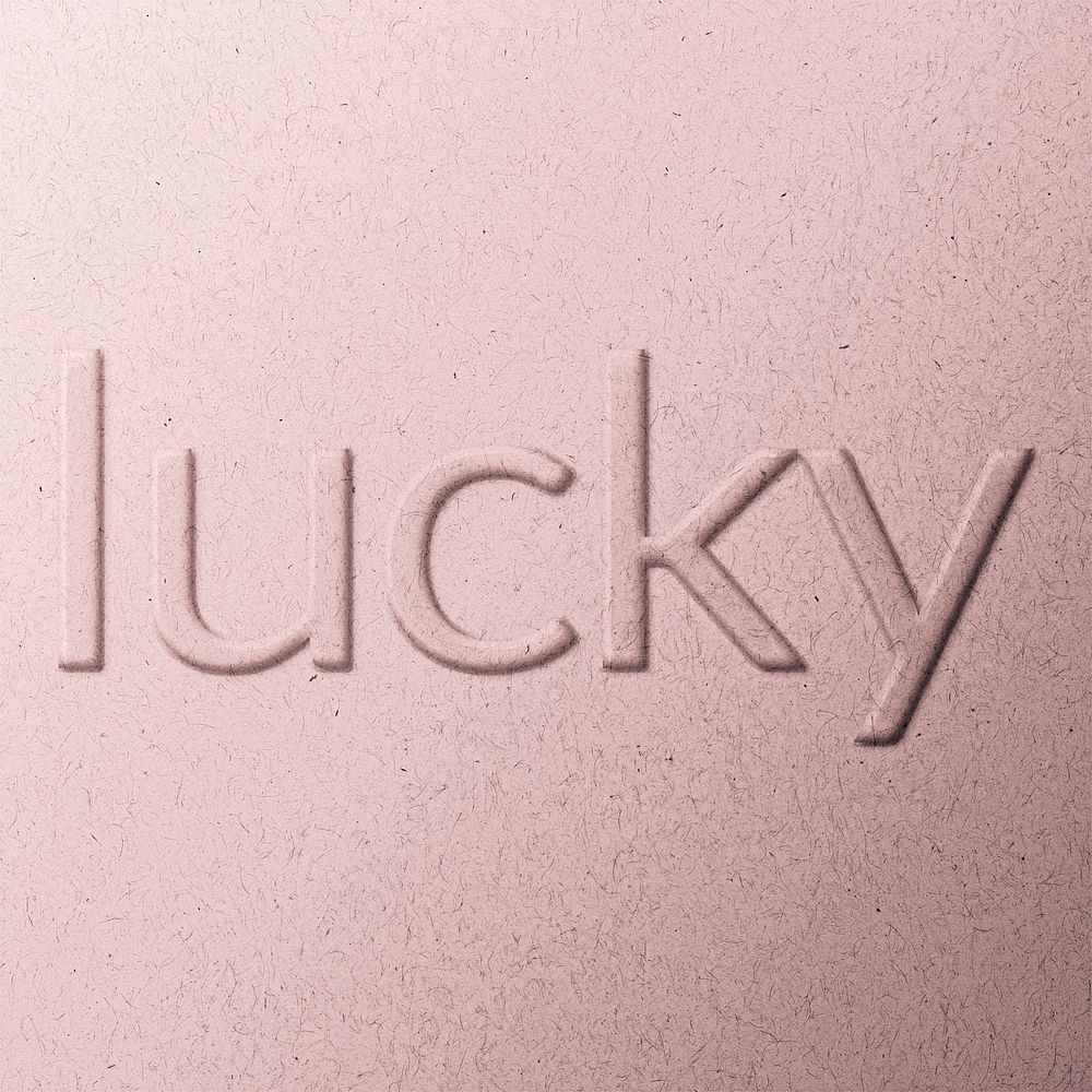 Lucky word embossed typography on paper texture