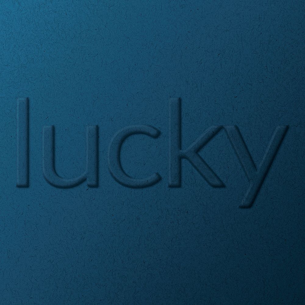 Lucky word embossed typography on paper texture
