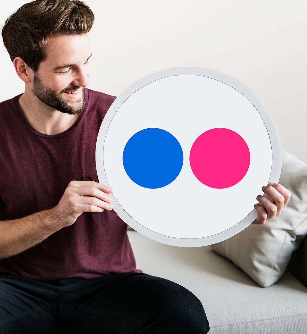 Person holding a Flickr icon