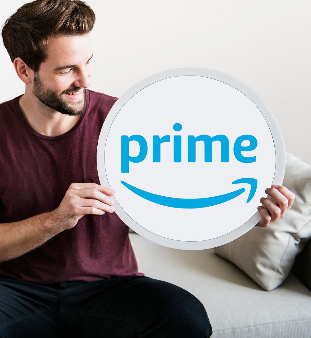 Person holding an Amazon Prime icon