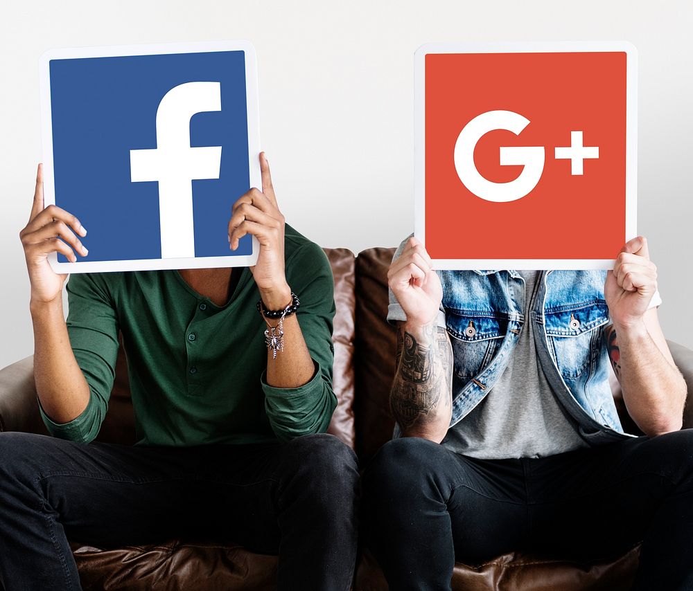 Person holding social media icons