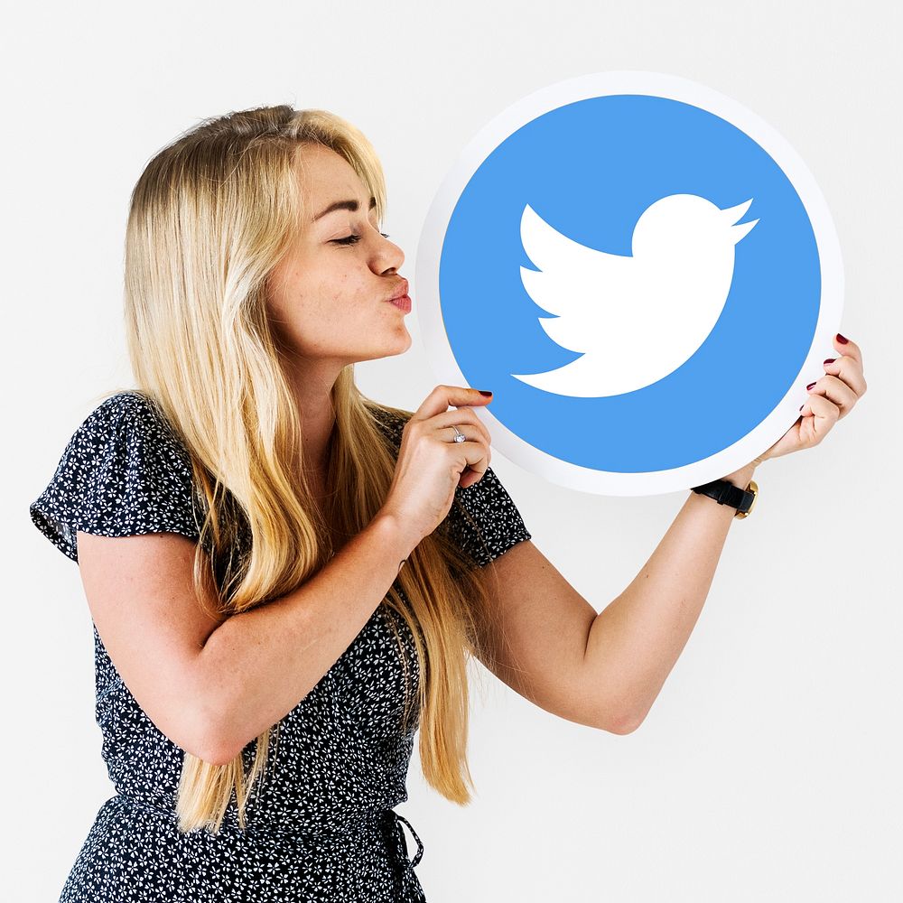 Woman blowing a kiss to a Twitter icon
