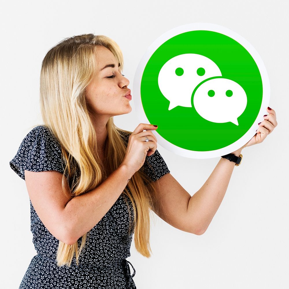 Woman blowing a kiss to a WeChat icon